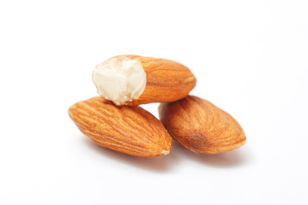 Processed almonds isolated on white backgroundの写真素材