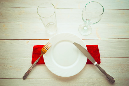 Knife and fork over wooden table with copy space. Diet Food concept.の写真素材