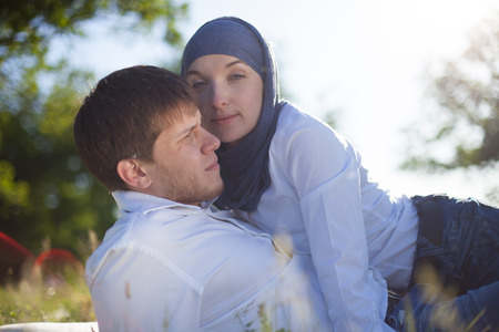 Outdoors portrait of a happy young coupleの写真素材