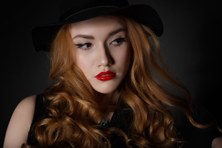Very Beautiful  Woman on the Dark Background of Dark Grey Wallの写真素材