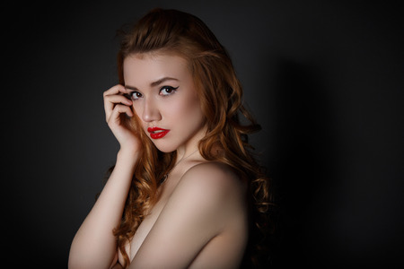 Very Beautiful  Woman on the Dark Background of Dark Grey Wallの写真素材