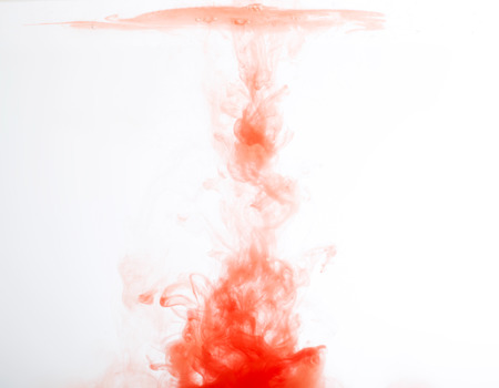 abstract pattern background with red ink in waterの写真素材
