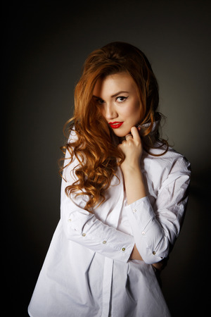 Beautiful  Woman on the Dark Background of Dark Wallの写真素材