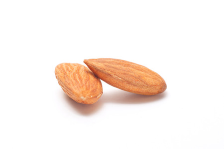 Processed almonds isolated on white background の写真素材