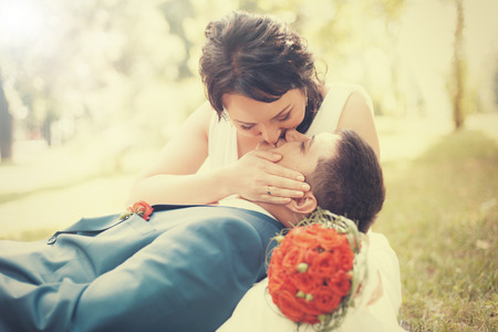 Newlyweds on Wedding Day. Bride and Groom kissing.の写真素材