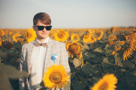 Portrait of handsome groom in the fieldの写真素材