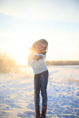 walking in the field on a sunny winter dayの写真素材