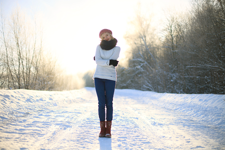 Happy young woman in winter clothingの写真素材