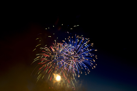 Beautiful colorful holiday fireworks on the black sky background,  long exposureの写真素材