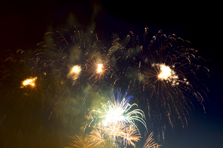 Beautiful colorful holiday fireworks on the black sky background,  long exposureの写真素材