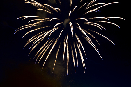 Brightly colorful fireworks and salute of various colors in the night skyの写真素材