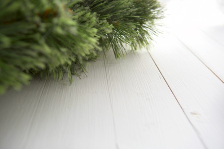 Christmas fir tree on a wooden board. Christmas background.の写真素材