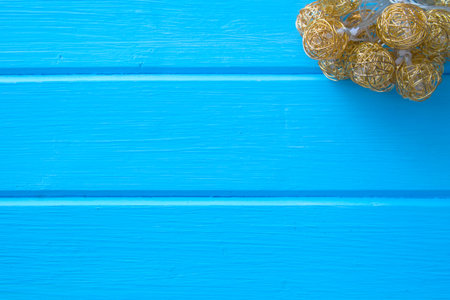 Fabric Christmas balls hanging on wooden background. Wood board table.の写真素材