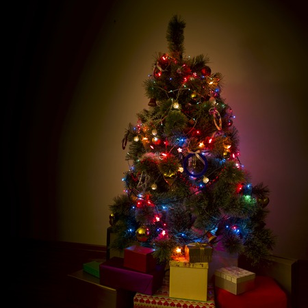 Beautifully decorated Christmas tree with many presents under it.の写真素材
