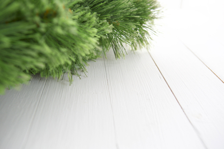 Christmas wooden background with fir tree and copy spaceの写真素材