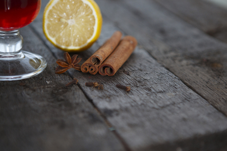 Collection of spices for mulled wine and pastry on the wooden tableの写真素材