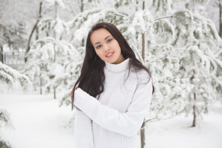 portrait of a beautiful brunette outdoors. Young girl winter sensual portrait. Beautiful brunette...
