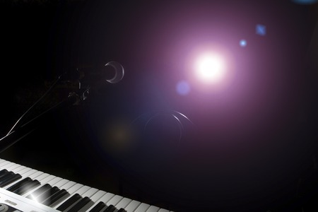 Microphone  and piano in the dark backgroundの写真素材
