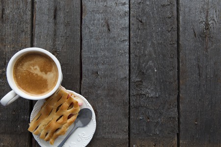 Apple pie with coffee on wooden tableの写真素材
