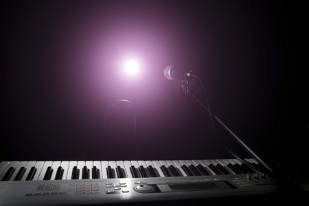 Microphone  and piano in the dark backgroundの写真素材