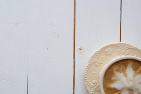 Coffee cup top view on wooden table backgroundの写真素材