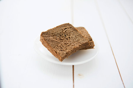 Straight rye bread on white wooden tableの写真素材