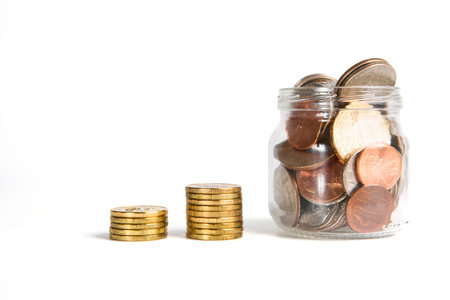 Business chart is made from golden ruble coins and jar with american coins, shows an increase,...
