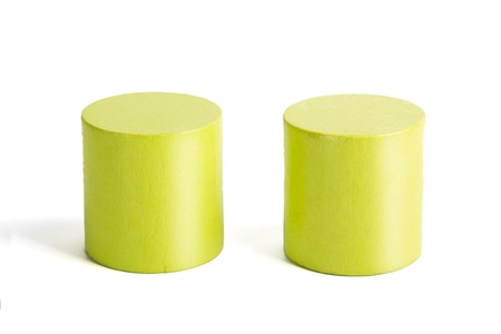 Wooden color green cylinders on a white backgroundの写真素材