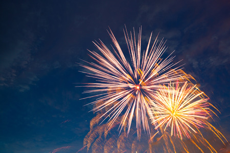 Fireworks display on 4th of July. Fireworks display on dark sky background. Independence Day, 4th of July, Fourth of July or New Year.の写真素材