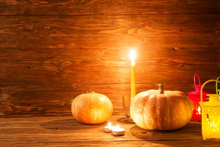 Lantern with burning candles and pumpkins. Greeting Card.の写真素材