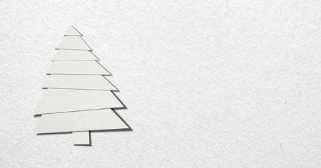 Christmas tree made of paper on white paper backgroundの写真素材