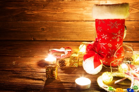 Lantern with candles, Christmas decor on wooden table. Greeting Card.の写真素材