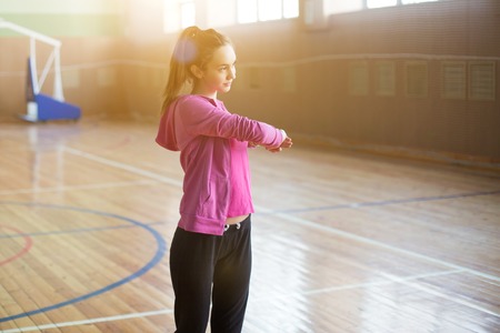Fitness woman exercising crossfit. View of beautiful young woman training.の写真素材