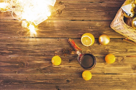 Still life, food and drink, seasonal and holidays concept. Christmas mulled wine on a rustic wooden table. Christmas mulled wine with spices and fruits on dark wooden table.の写真素材
