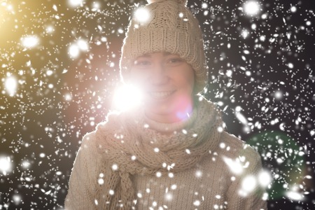 Beauty girl on the winter background in studioの写真素材