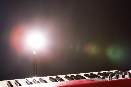 Piano in the dark background with lightの写真素材