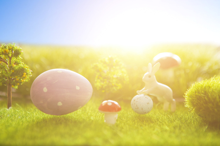 Colorful Easter egg with easter bunny in the fresh spring meadow.の写真素材