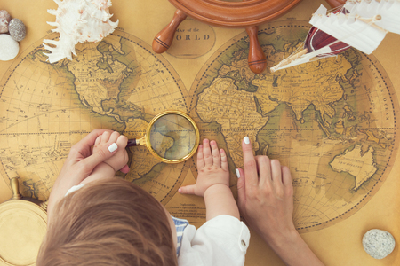 Antique Map of the World with steering wheel and sea shell.の写真素材