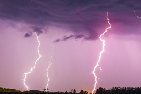Lightning bolt on the dark cloudy sky.の写真素材