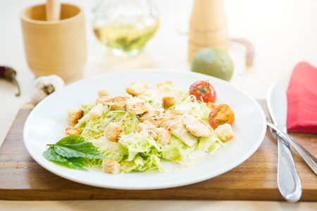 Homemade Vegetable salad with chicken and cheese on table.の写真素材