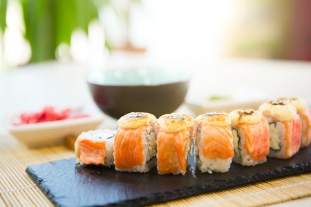 homemade sushi with salmon, cream cheese Philadelphia, Japanese omelette, cucumber and wasabi. selective focus.の写真素材