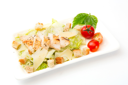 The Caesar salad prepared on the classical recipe on white.の写真素材