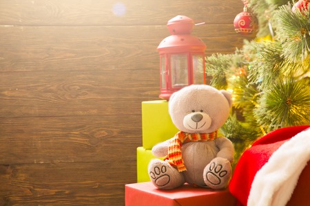 Decorated Christmas tree and gift boxes against wooden background with copy space. Christmas morning.の写真素材