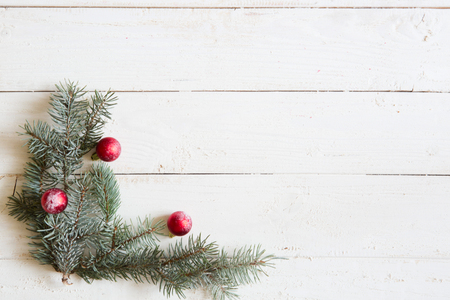 Christmas background fir tree and christmas decorations on wooden table with copy space. Top view.の写真素材