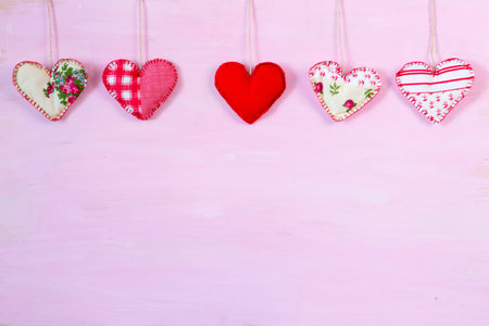Hearts on string. Romantic love vintage wooden background.