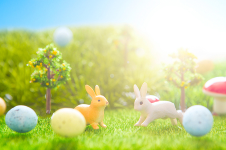 Easter rabbits toy on spring green grass. Fairy tale.の写真素材