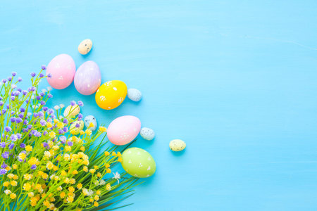 Easter eggs decoration on a wooden table. Top view.