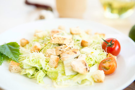 Homemade Vegetable salad with chicken and cheese on table.の写真素材