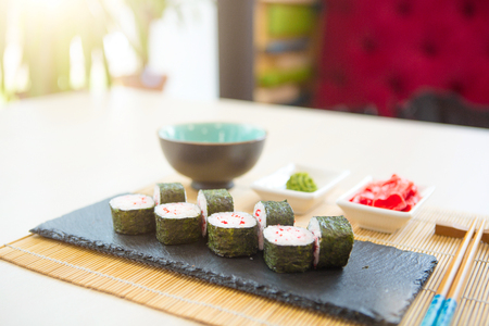 Sushi rolls on black slate surface. Japanese food.の写真素材