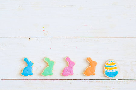 Easter cookies on white wooden table. Happy Easter concept.